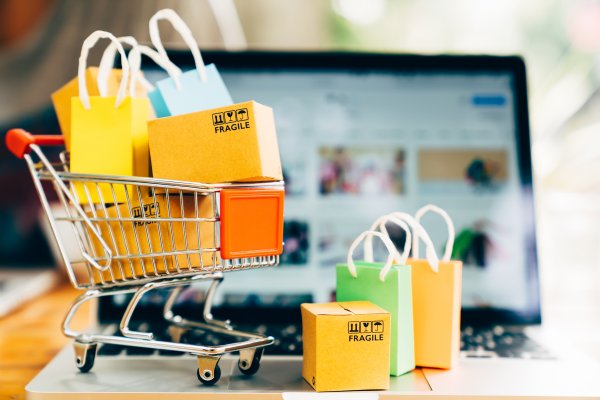 ecommerce shopping cart jimdo boxes packages in shopping cart on laptop